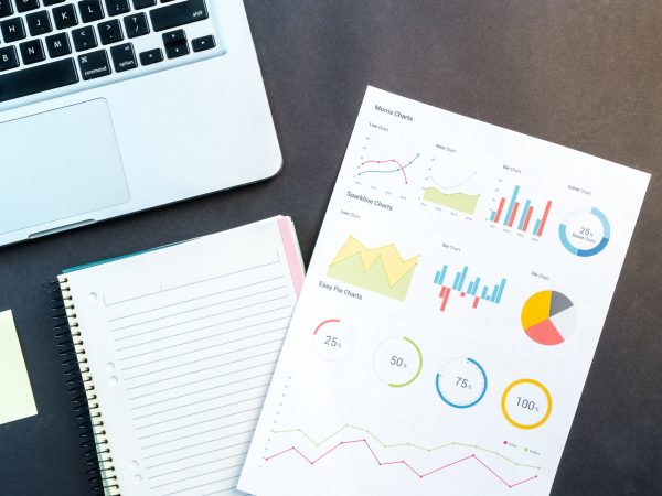 macbook-pro-beside-papers-669619